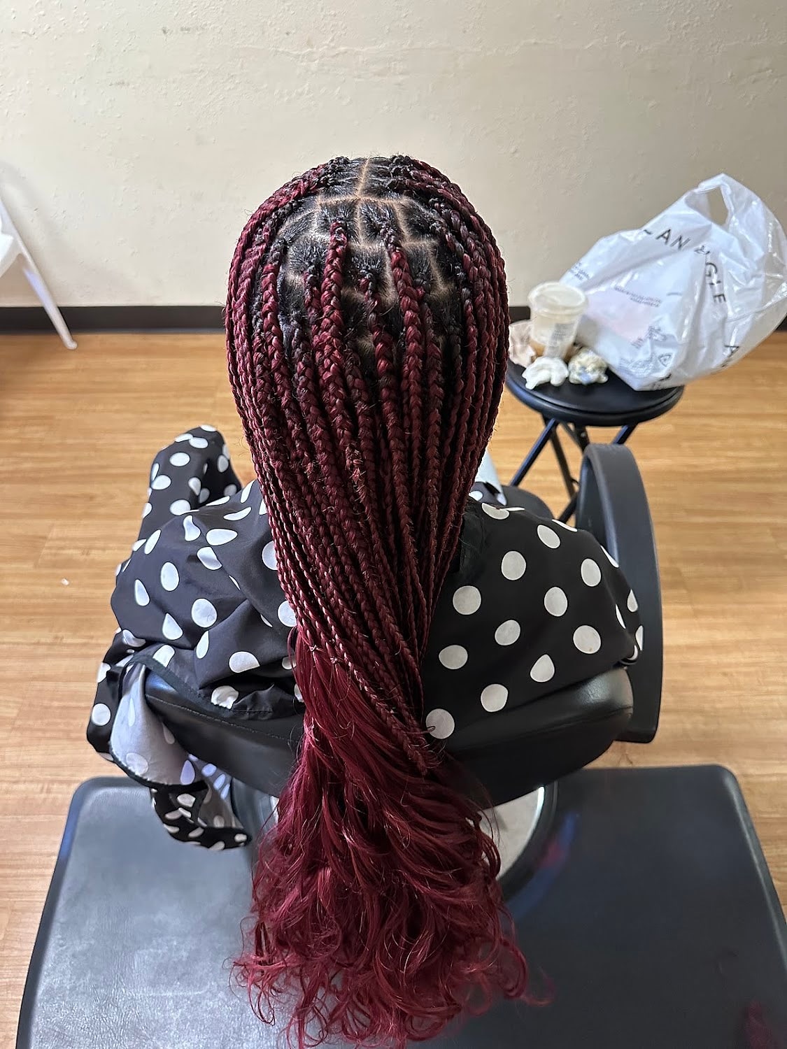 Long burgundy knotless braids past the waist