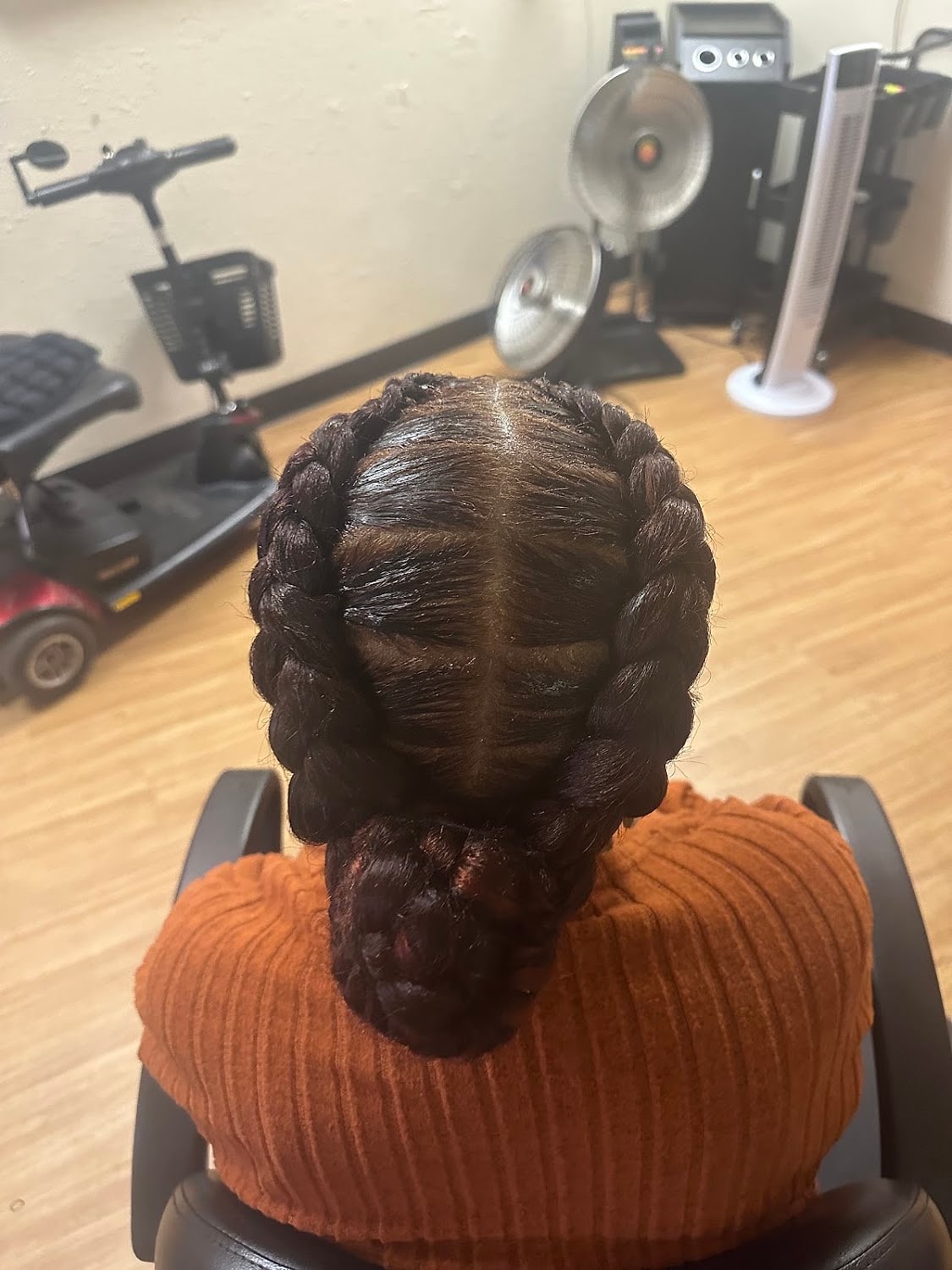 Two thick feed-in braids running straight back