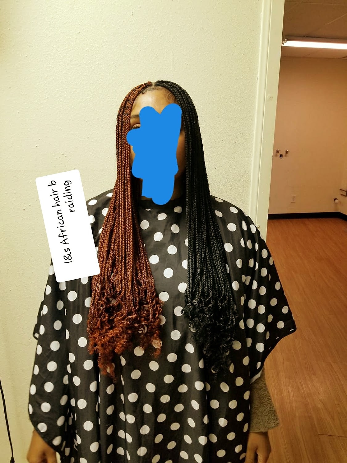 Long auburn braids draped over the shoulder