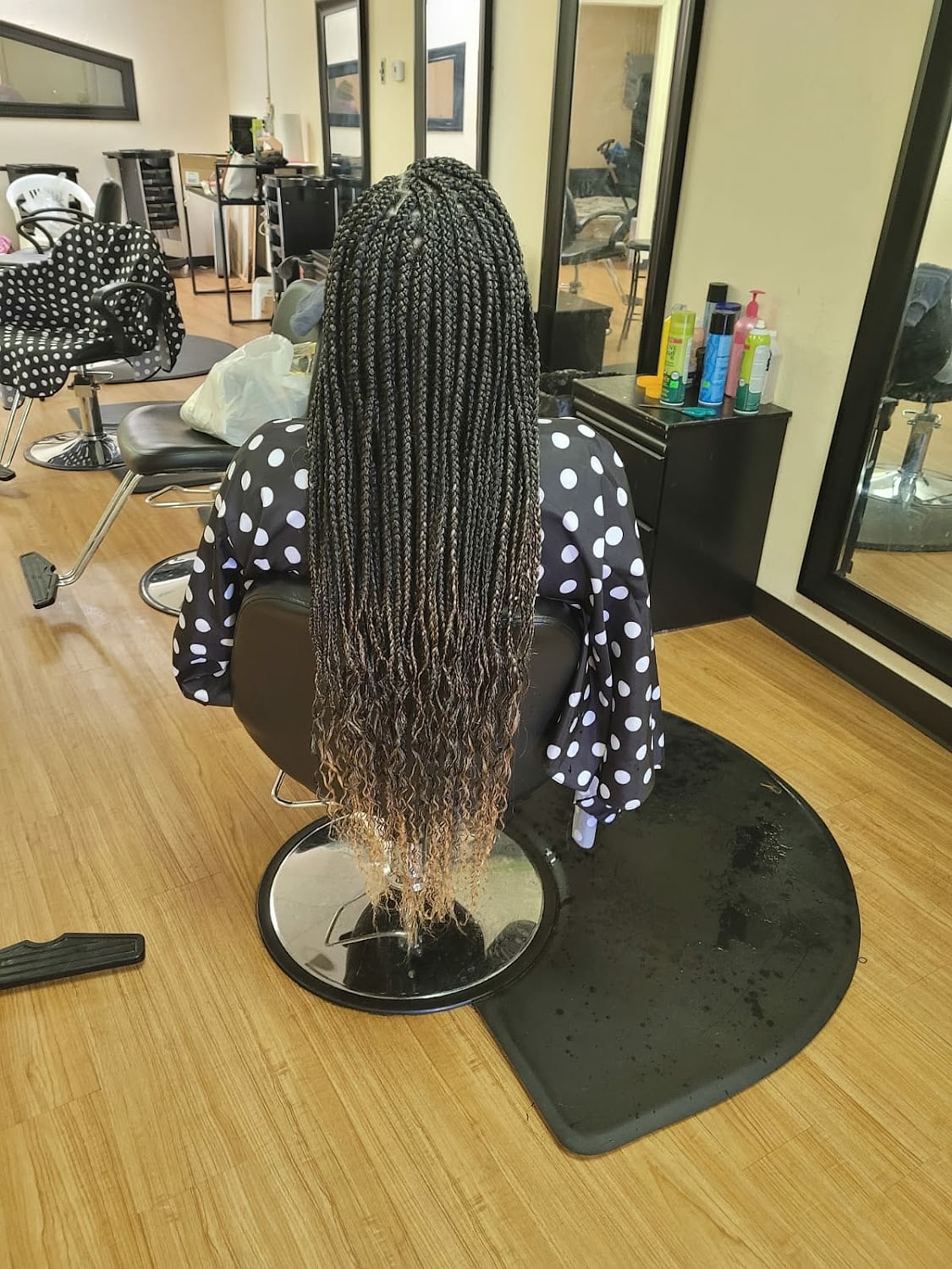 Waist-length braids finished in the chair